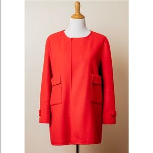 Coat with large pockets and back belt detailing